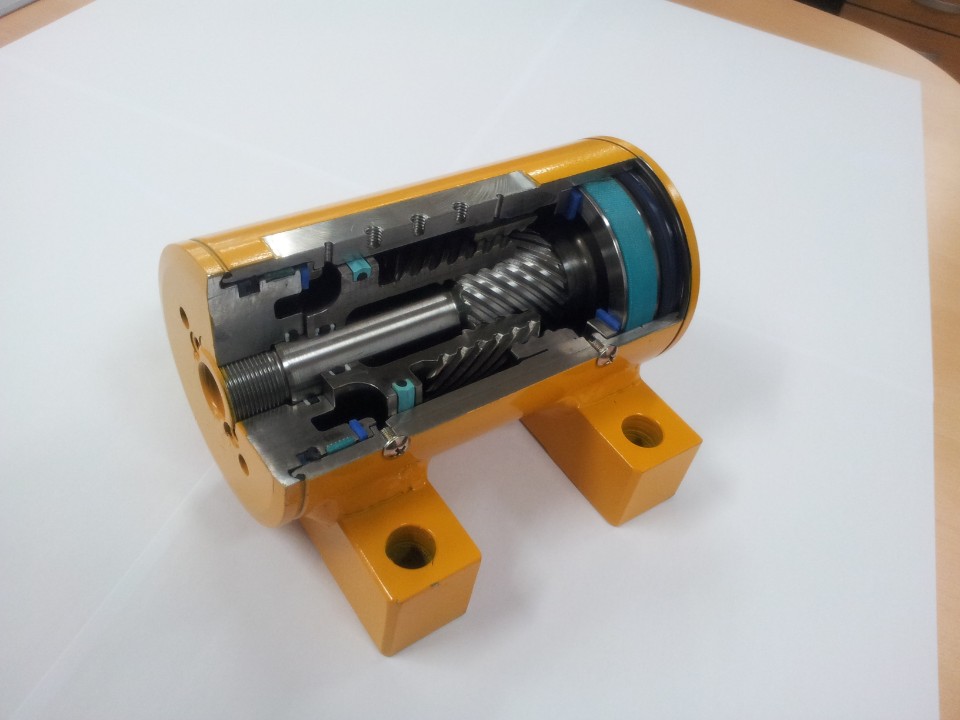 A yellow and blue machine with a prominent gear that showcases its mechanical design and functionality.